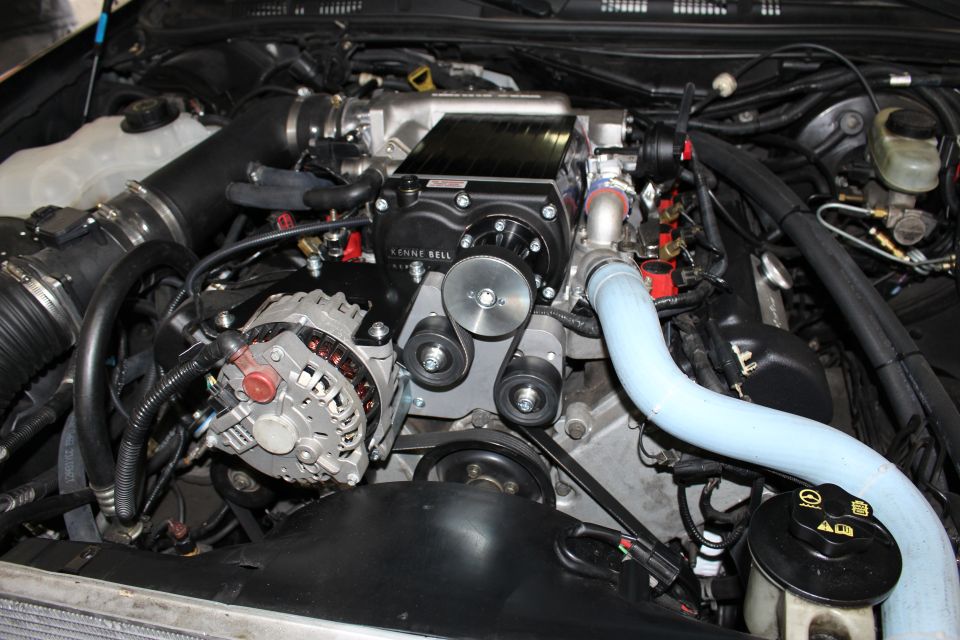 Engine bay with Kenne Bell supercharger, alternator and coolant hose
