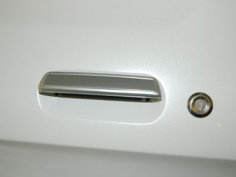 1979 Ford Bronco - Detail of a vehicle's door handle and lock cylinder, with a Supermotors.net watermark visible.