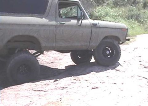 1978 Ford Bronco - This classic 1978 Ford Bronco is shown from the side, lifted with large off-road tires.