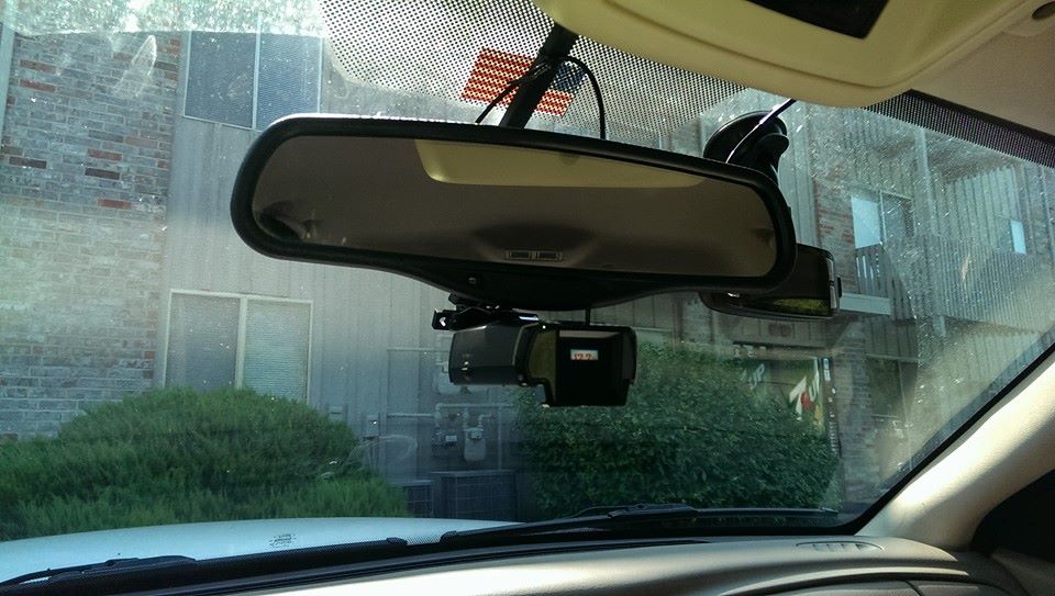 Dashboard camera and rearview mirror mounted on windshield