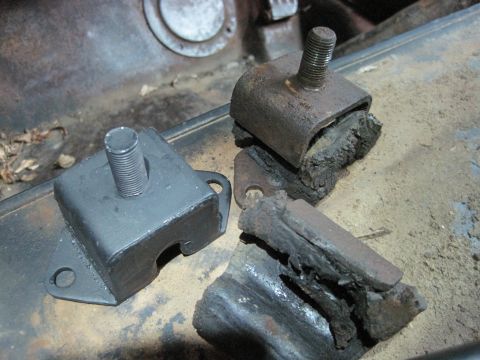 1946 Jeep Willys - Comparison of a new engine mount next to old, deteriorated ones.