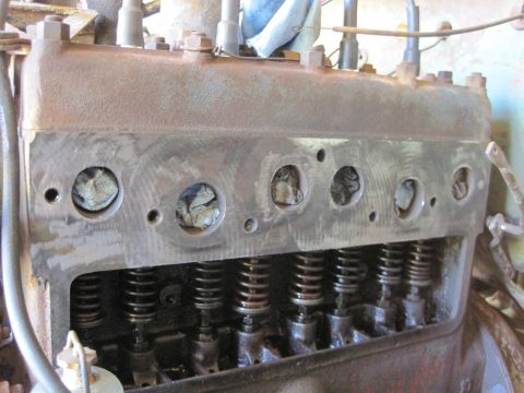 1946 Jeep Willys - The internal components of an engine's cylinder head are shown, with valves and springs exposed.