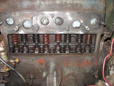 1946 Jeep Willys - The internal components of an engine, showing the valve springs and lifters, are exposed for maintenance or repair.