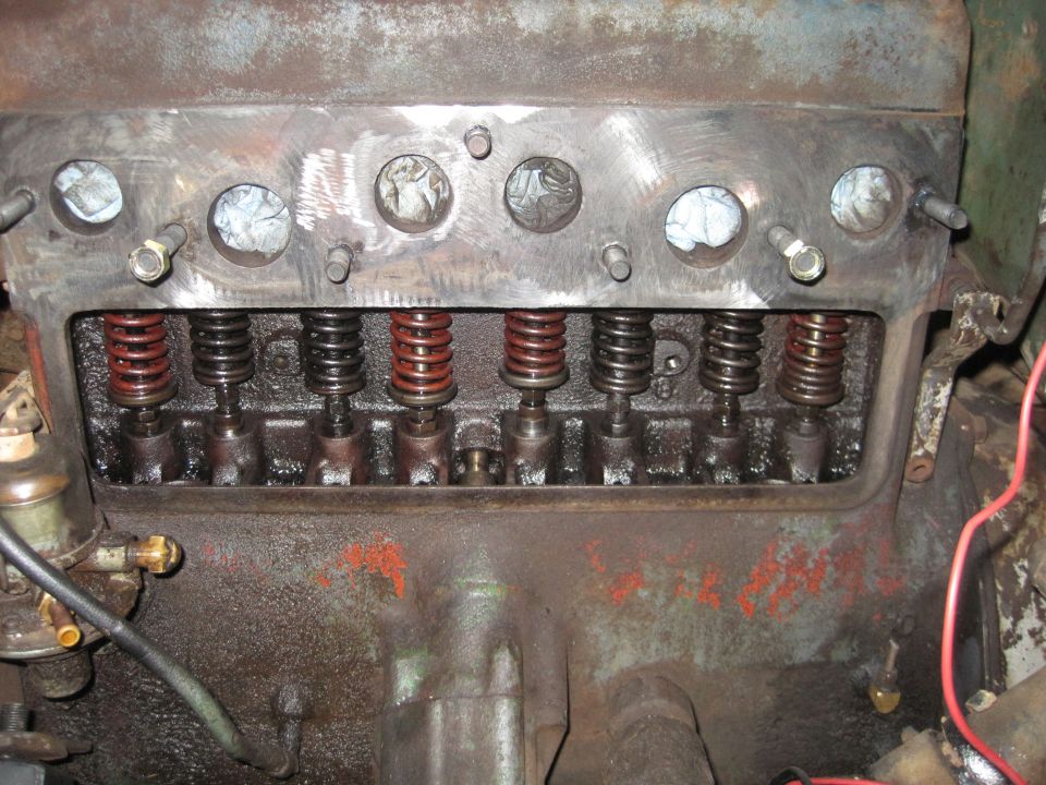 Close-up of an engine's valve train with springs and lifters visible