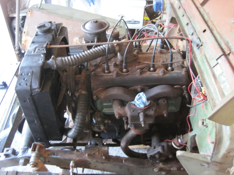 Engine bay with radiator and inline-six engine