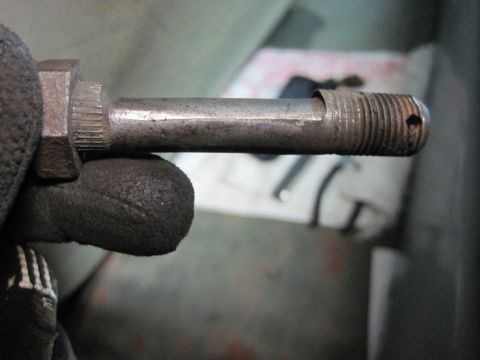 1946 Jeep Willys - Close-up of a metal bolt, likely a component for a vehicle.