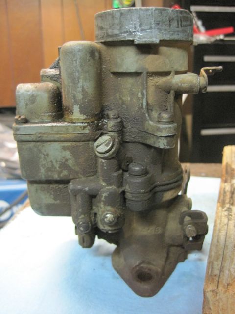 1946 Jeep Willys - This is a close-up view of a carburetor, showing its various components and signs of wear.