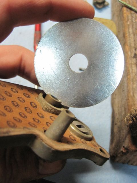 1946 Jeep Willys - A metal disc is positioned over a component a repeating circular pattern. The Supermotors.net logo is visible in the lower right corner.