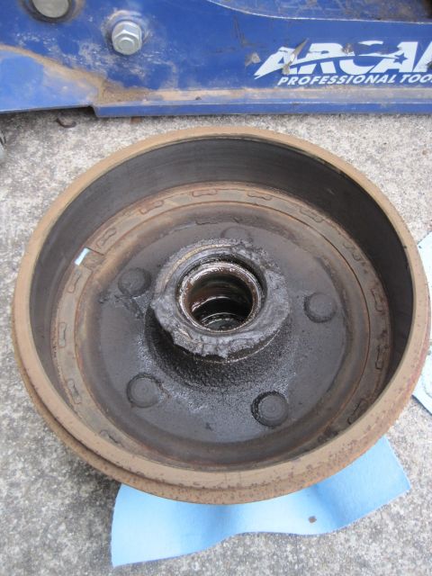 1946 Jeep Willys - Close-up of a rusty drum brake assembly, likely for an older vehicle.