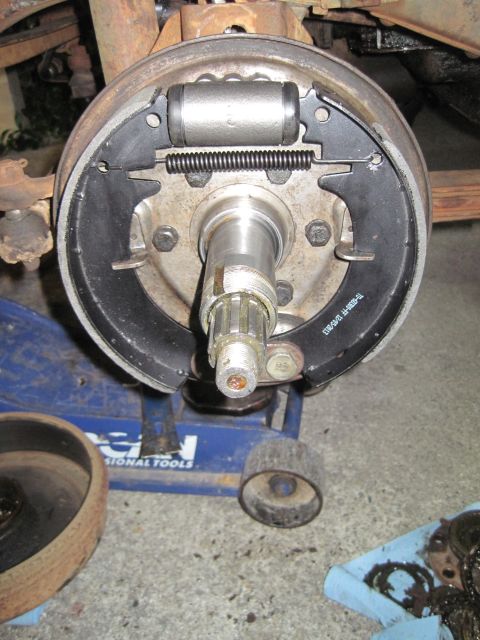 1946 Jeep Willys - A vehicle's brake drum assembly is shown with new brake shoes and a wheel cylinder installed.