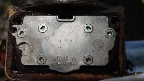 1984 Ford Bronco - Close-up of a metal plate with part number 34R-9716B and UDC 7 stamped on it.