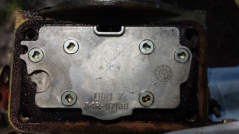 Metal plate with part number 34R-9716B and UDC 7