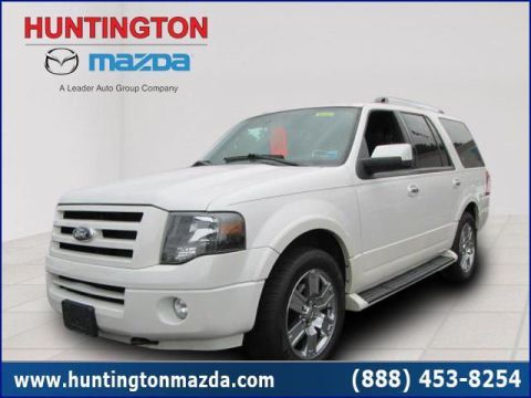 2009 Ford Expedition - A white Ford Expedition SUV is shown from the front passenger side with dealership branding at the top.