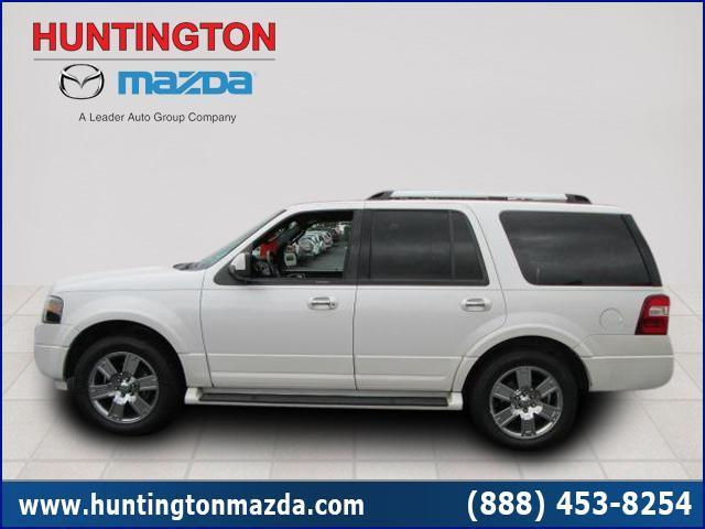 White Ford Expedition SUV parked on a tiled floor, side view