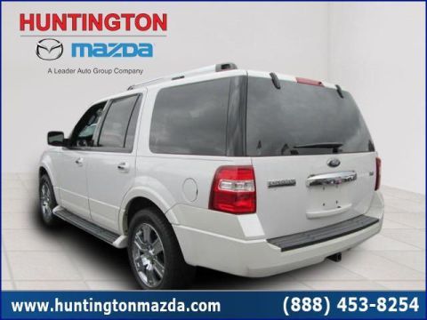 2009 Ford Expedition - Rear view of a white 2009 Ford Expedition, showing its taillights and tailgate.