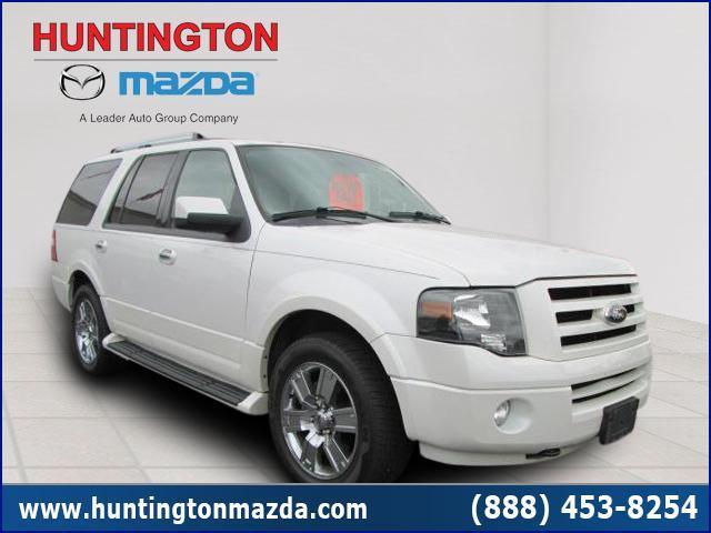 White 2009 Ford Expedition parked indoors, front passenger side visible