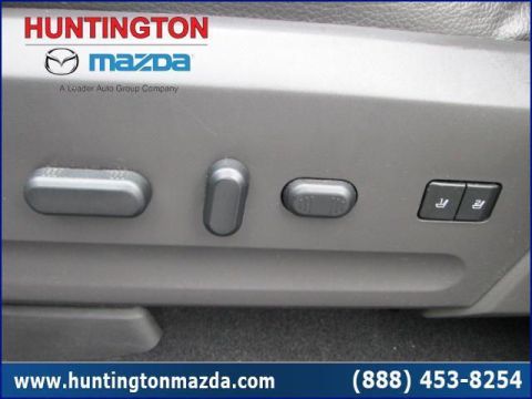 2009 Ford Expedition - Close-up of power seat controls on a vehicle's interior.
