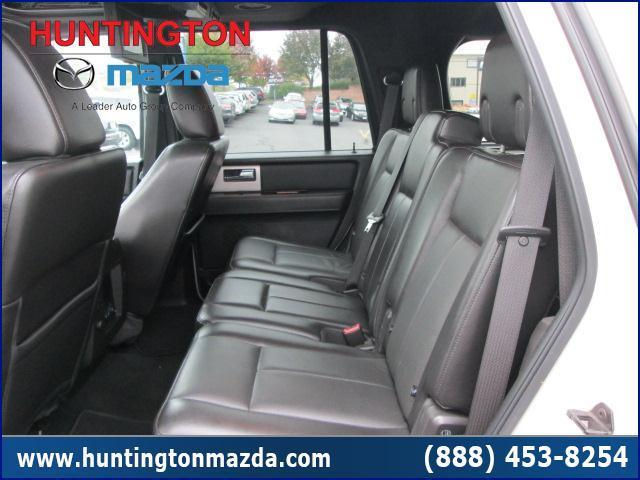 Interior view of a white SUV's rear seats and door panel