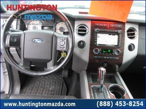 2009 Ford Expedition - The interior of a 2009 Ford Expedition shows the dashboard, steering wheel, and center console.