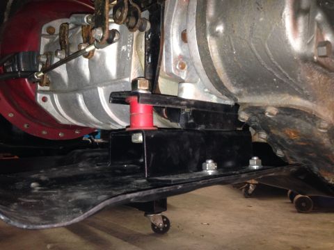 1986 Jeep Wagoneer - Close-up view of a transmission mount assembly, showing its mechanical components and support structure.