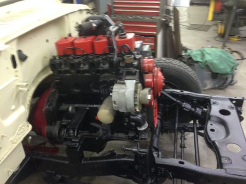 1986 Jeep Wagoneer - Engine and chassis components are visible in this workshop setting.