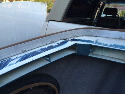 1995 Ford Bronco - The mounting channel for the soft top on this 1995 Ford Bronco shows some wear and blue paint.