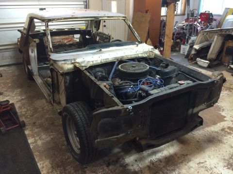 1964 Ford Fairlane - This 1964 Ford Fairlane is undergoing disassembly in a workshop environment.