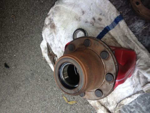 1978 Ford Bronco - Close-up of a vehicle's wheel hub and red brake caliper, resting on a white towel.