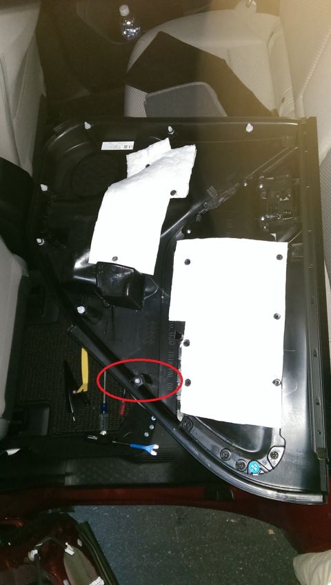 2015 Subaru Forester - Driver's side rear door. Red circle shows the clip anchor that cracks easily.