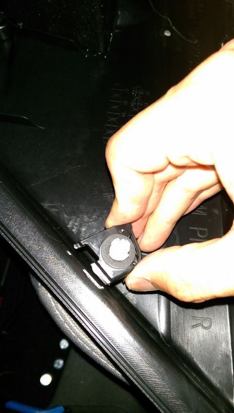 2015 Subaru Forester - Driver's side rear door. Close-up of the anchor that cracks easily.