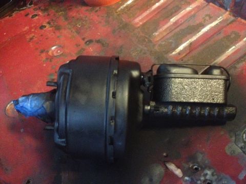 1978 Ford Bronco - A black brake booster and master cylinder assembly is shown, likely before installation into a vehicle.