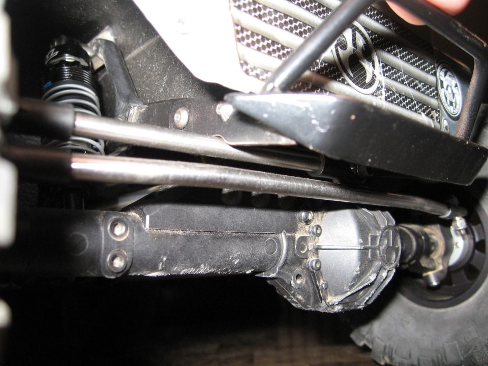 Close-up of front suspension and grille on a toy vehicle