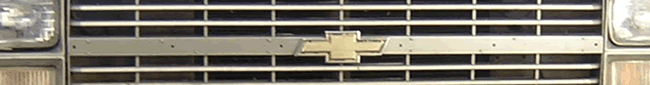 Close-up of a horizontal bar grille, likely from a vehicle