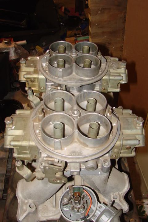 1972 Ford Ranchero - A dual quad carburetor setup is shown mounted on an engine intake manifold, with a visible distributor at the base.