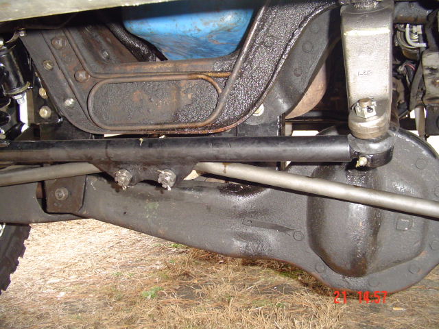 Undercarriage of a vehicle, showing suspension components and differential housing