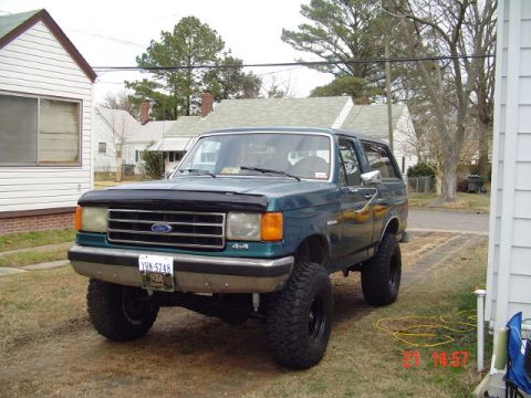 1989 Ford Bronco - This 1989 Ford Bronco features a lifted suspension and large off-road tires, giving it a stance.