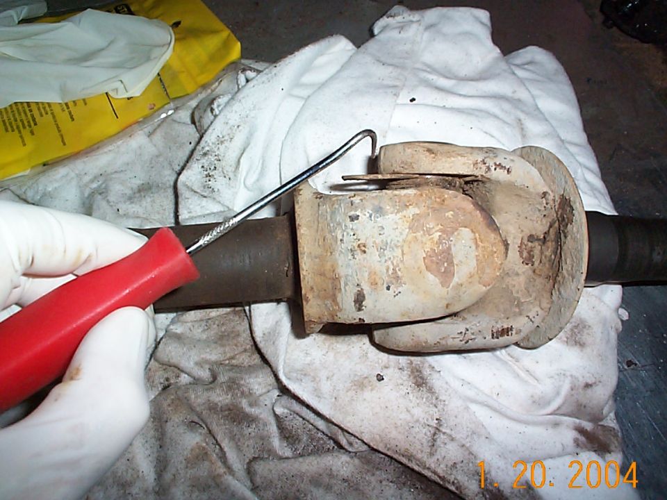 Taking the c-clips out was a little difficult, I was able to get this one out with a pick, but the other ones I had to use a punch. There was a lot of dirt on here, so I had to clean it off before I could see the clip.