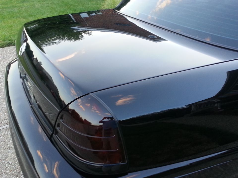 Black 2003 Mercury Marauder rear quarter panel and trunk lid with tinted taillights