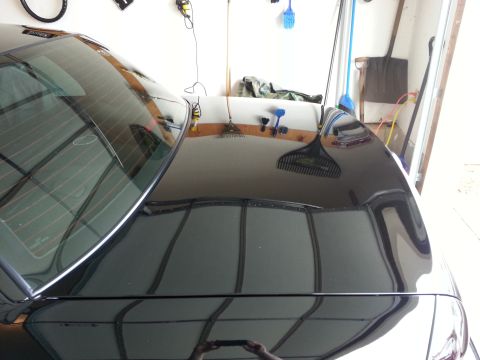 2003 Mercury Marauder - The rear of a black 2003 Mercury Marauder is shown, reflecting the garage environment.