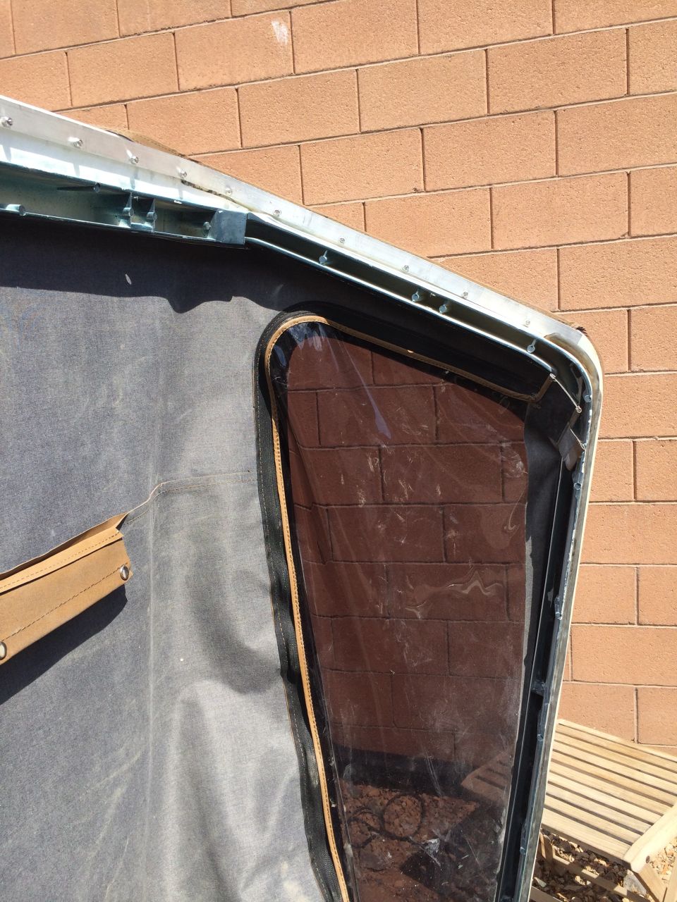 Soft top window frame with clear plastic showing brick pattern