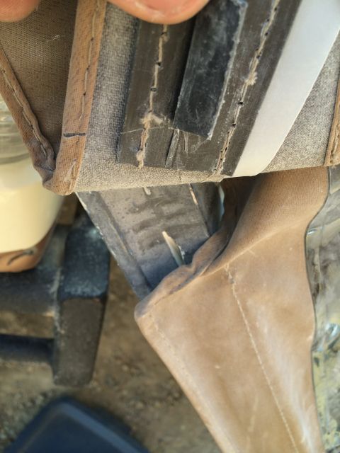 1995 Ford Bronco - Detail of the soft top's edge, revealing the fabric, stitching, and rubber seal.