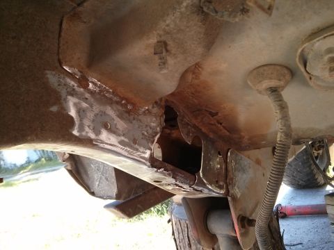 1986 Ford Bronco - Significant rust and damage are visible on the vehicle's frame, indicating structural compromise.
