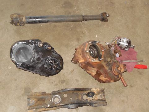 1975 Ford Bronco - When the new gasket arrives, the reman case can go on. The silver part at the top R is the working piece of the Advance Adapter kit to hang…