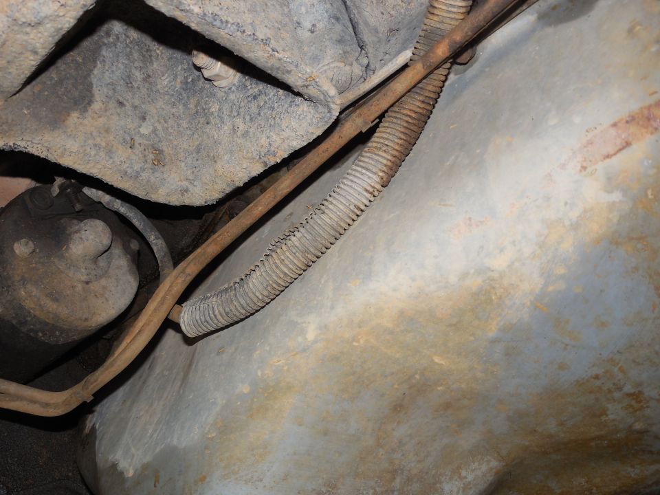 The rubber pan gasket we installed when we painted the pan during the initial build has held up fairly well, but there was a little dampness along the seam.