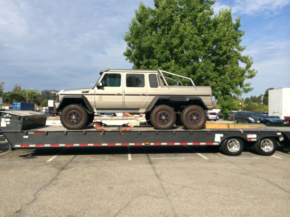 Six-wheeled Mercedes-Benz G-Wagen on a flatbed trailer