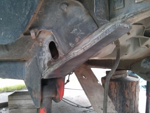 1986 Ford Bronco - Undercarriage view showing frame structure and suspension components.