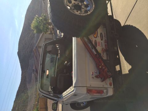 1995 Ford Bronco - This 1995 Ford Bronco is equipped for off-road adventures with large tires and a mounted Hi-Lift jack.