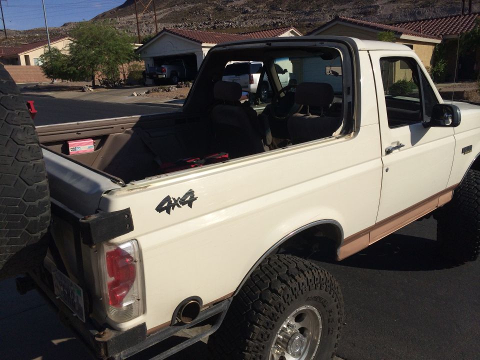 1995 Ford Bronco, white, soft top removed, spare tire mounted on rear