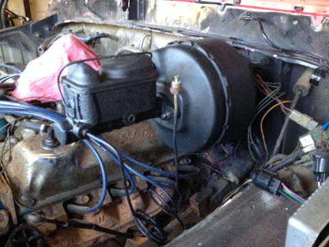 1978 Ford Bronco - Close-up of brake booster and master cylinder assembly, part of a vehicle's braking system.