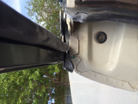 1995 Ford Bronco - The rubber seal on the door frame shows wear and tear, indicating potential issues with weatherproofing.
